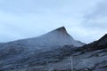 Hikers trekking towards the misty LowÃ¢â¬â¢s Peak, Mount Kinabalu before sunrise